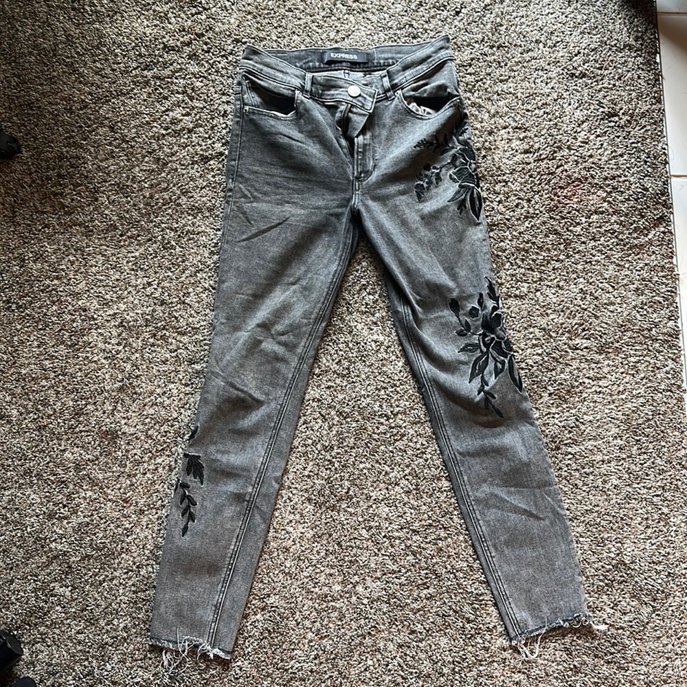 Women’s floral black and grey express jeans size 6R.